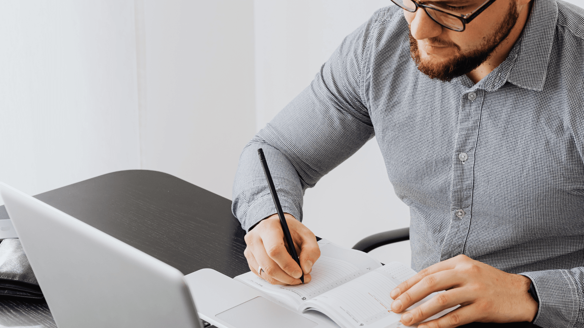 Business owner reviewing plans and considering the next stage of growth