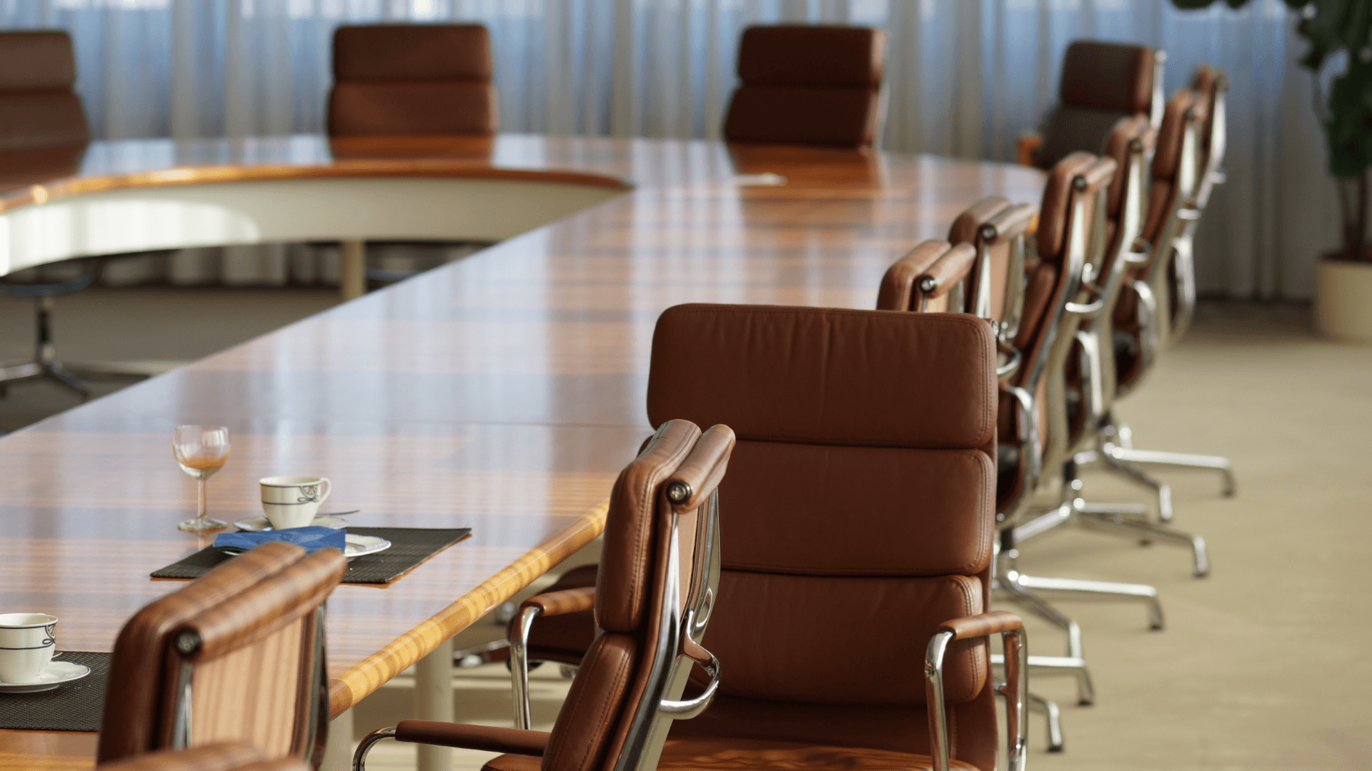 A business consultant and client engaged in a collaborative discussion, highlighting the value of a neutral third party in succession planning